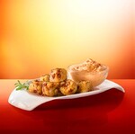 Chorizo Stuffed Idaho® Potato Tots with Skordalia