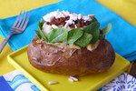 Baked Idaho® Potato with Baby Spinach, Tapenade and Goat Cheese with Pine Nuts